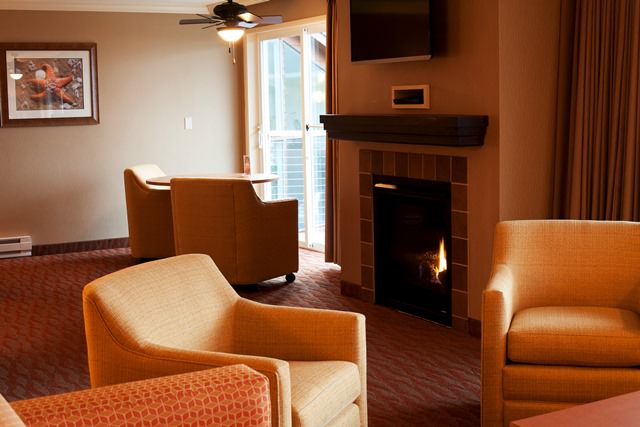Lounge chairs in a hospitality room at Hallmark Resort & Spa Cannon Beach